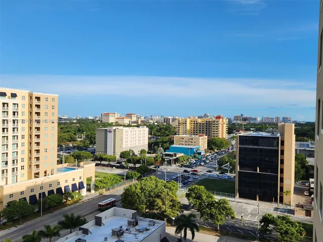 a view of a city with tall buildings