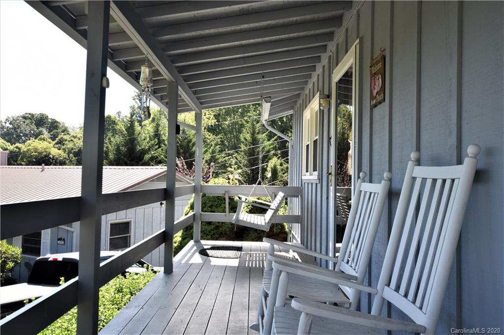 238 Raven Ridge Maggie Valley, NC 28751 - Photo 5 of 21 a view of a porch with furniture and a gate