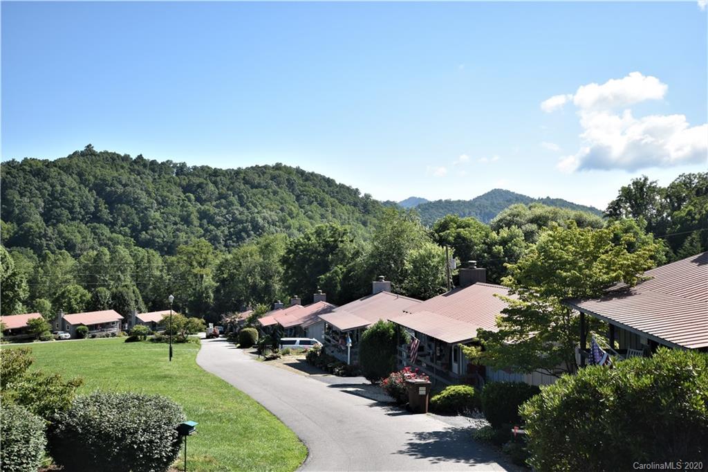 238 Raven Ridge Maggie Valley, NC 28751 - Photo 7 of 21 an aerial view of a houses with a garden and trees