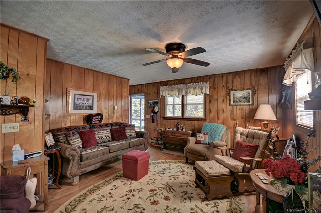 238 Raven Ridge Maggie Valley, NC 28751 - Photo 9 of 21 a living room with furniture ceiling fan and a window