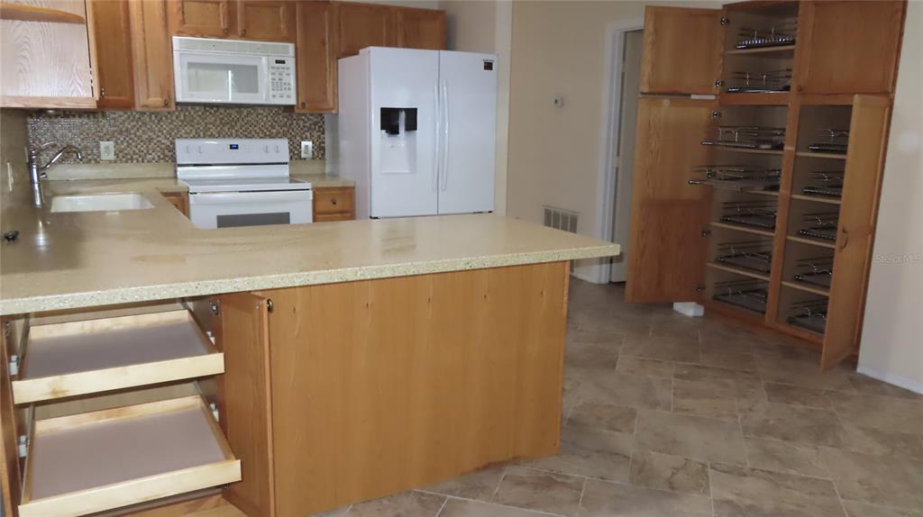 2291 Americus Boulevard West, Unit 7 Clearwater, FL 33763 - Photo 18 of 57 a view of cabinets and wooden floor