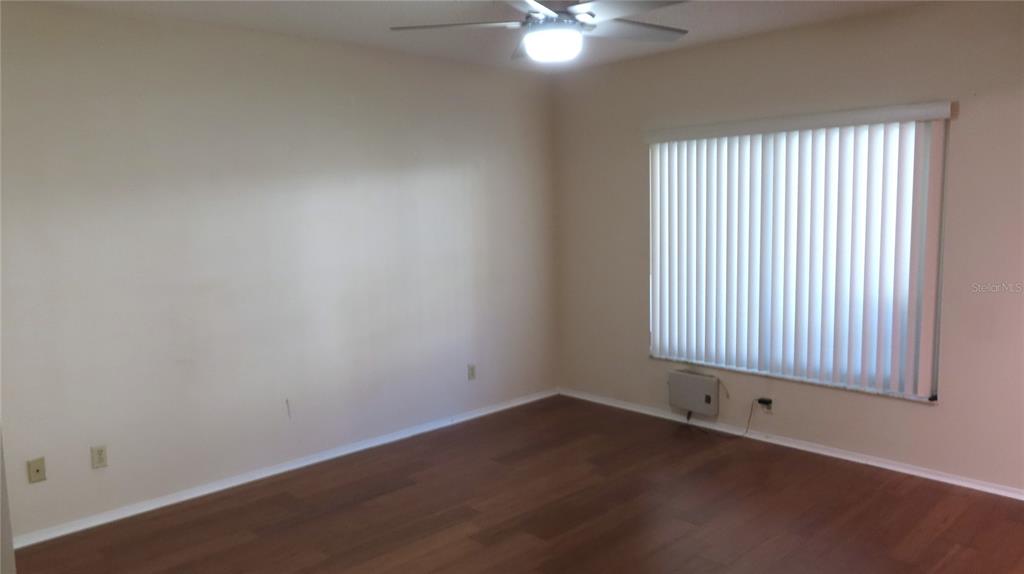2291 Americus Boulevard West, Unit 7 Clearwater, FL 33763 - Photo 26 of 57 an empty room with a window