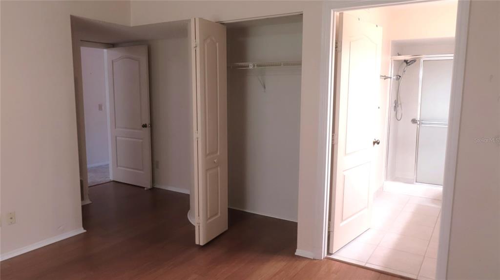2291 Americus Boulevard West, Unit 7 Clearwater, FL 33763 - Photo 28 of 57 a view of an empty room with wooden floor