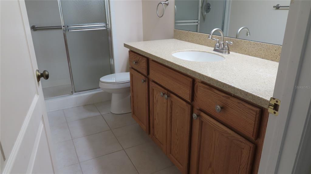 2291 Americus Boulevard West, Unit 7 Clearwater, FL 33763 - Photo 31 of 57 a bathroom with a sink toilet and shower