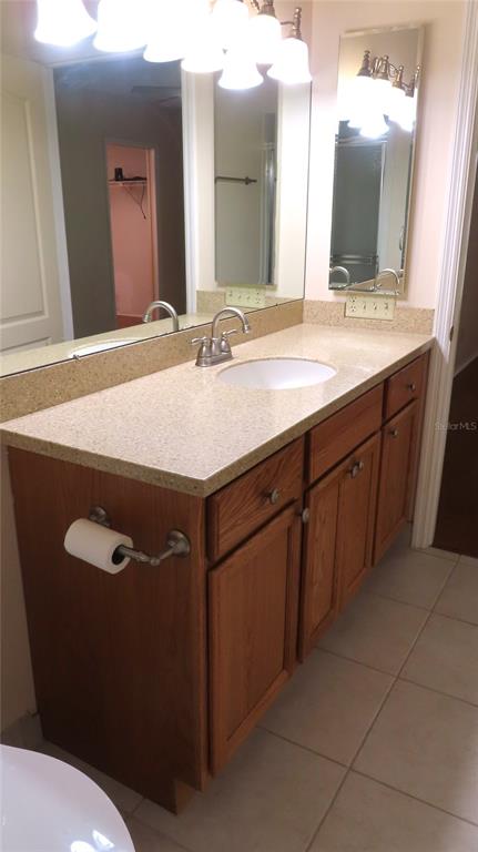 2291 Americus Boulevard West, Unit 7 Clearwater, FL 33763 - Photo 33 of 57 a bathroom with a sink and a mirror
