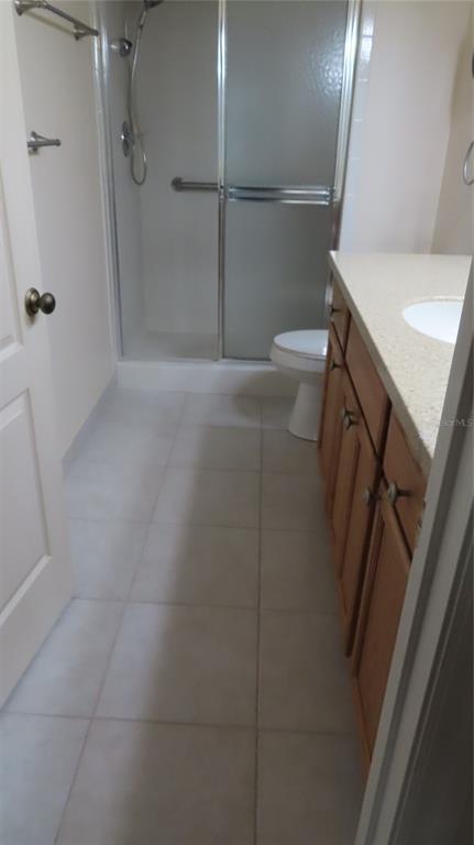 2291 Americus Boulevard West, Unit 7 Clearwater, FL 33763 - Photo 36 of 57 a bathroom with a shower and a toilet