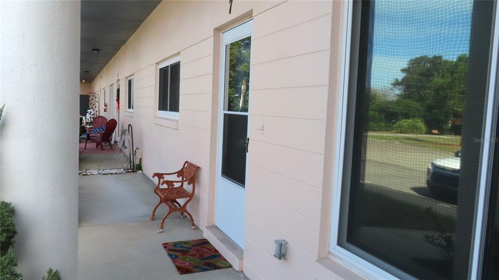 2291 Americus Boulevard West, Unit 7 Clearwater, FL 33763 - Photo 4 of 57 a view of chair in the balcony