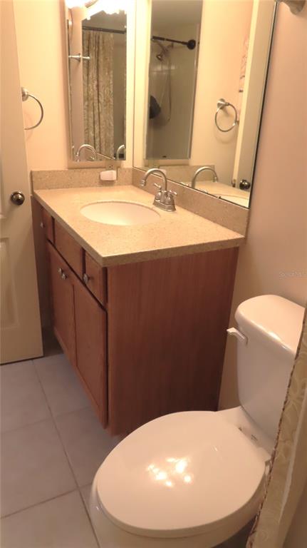 2291 Americus Boulevard West, Unit 7 Clearwater, FL 33763 - Photo 46 of 57 a bathroom with a sink and a mirror