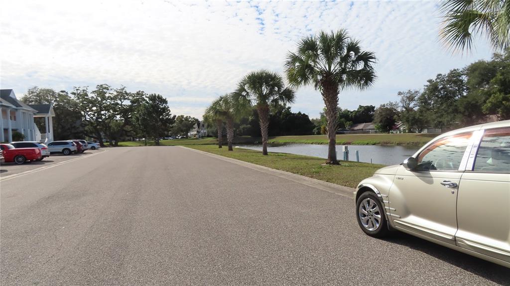 2291 Americus Boulevard West, Unit 7 Clearwater, FL 33763 - Photo 56 of 57 a view of street with parked cars