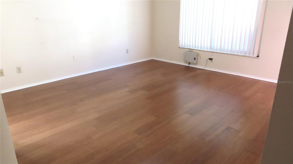 2291 Americus Boulevard West, Unit 7 Clearwater, FL 33763 - Photo 10 of 57 an empty room with a window