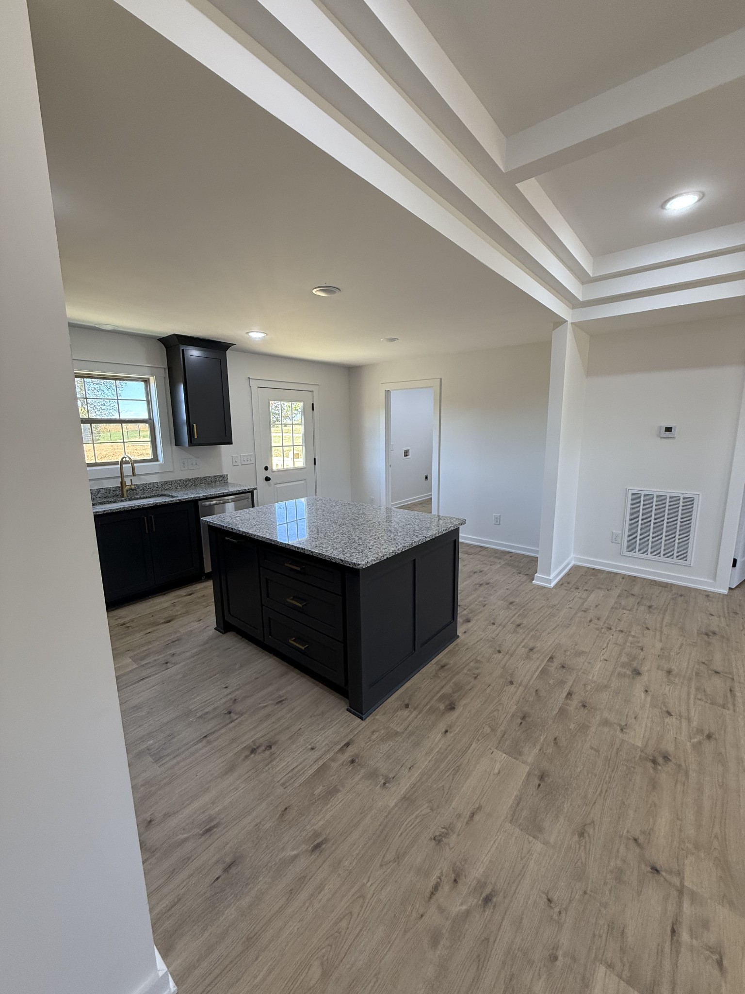 4827 Akersville Road Lafayette, TN 37083 - Photo 4 of 14 a living room with stainless steel appliances kitchen island granite countertop a refrigerator and a stove top oven