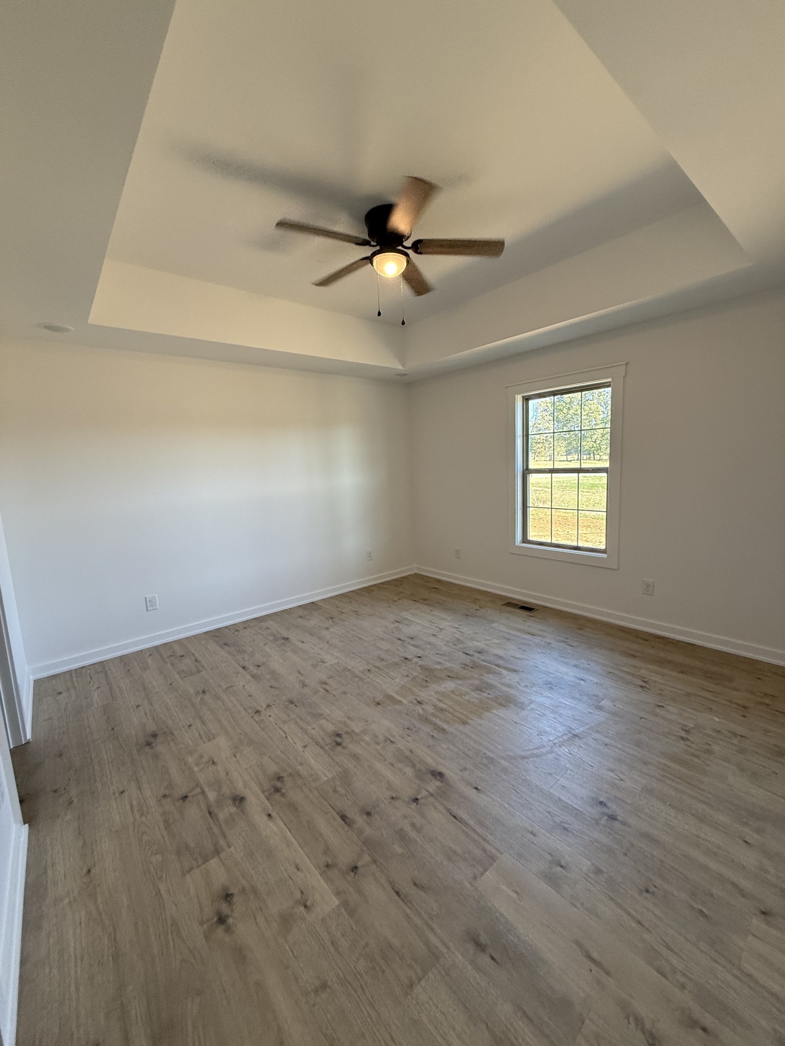 4827 Akersville Road Lafayette, TN 37083 - Photo 5 of 14 wooden floor in an empty room with a window