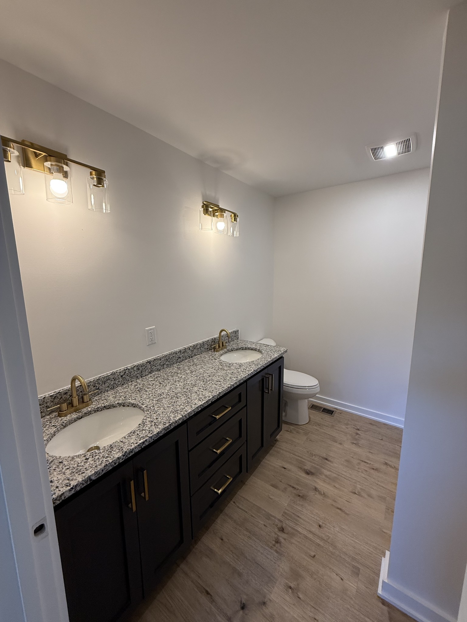4827 Akersville Road Lafayette, TN 37083 - Photo 6 of 14 a bathroom with a granite countertop sink and a mirror