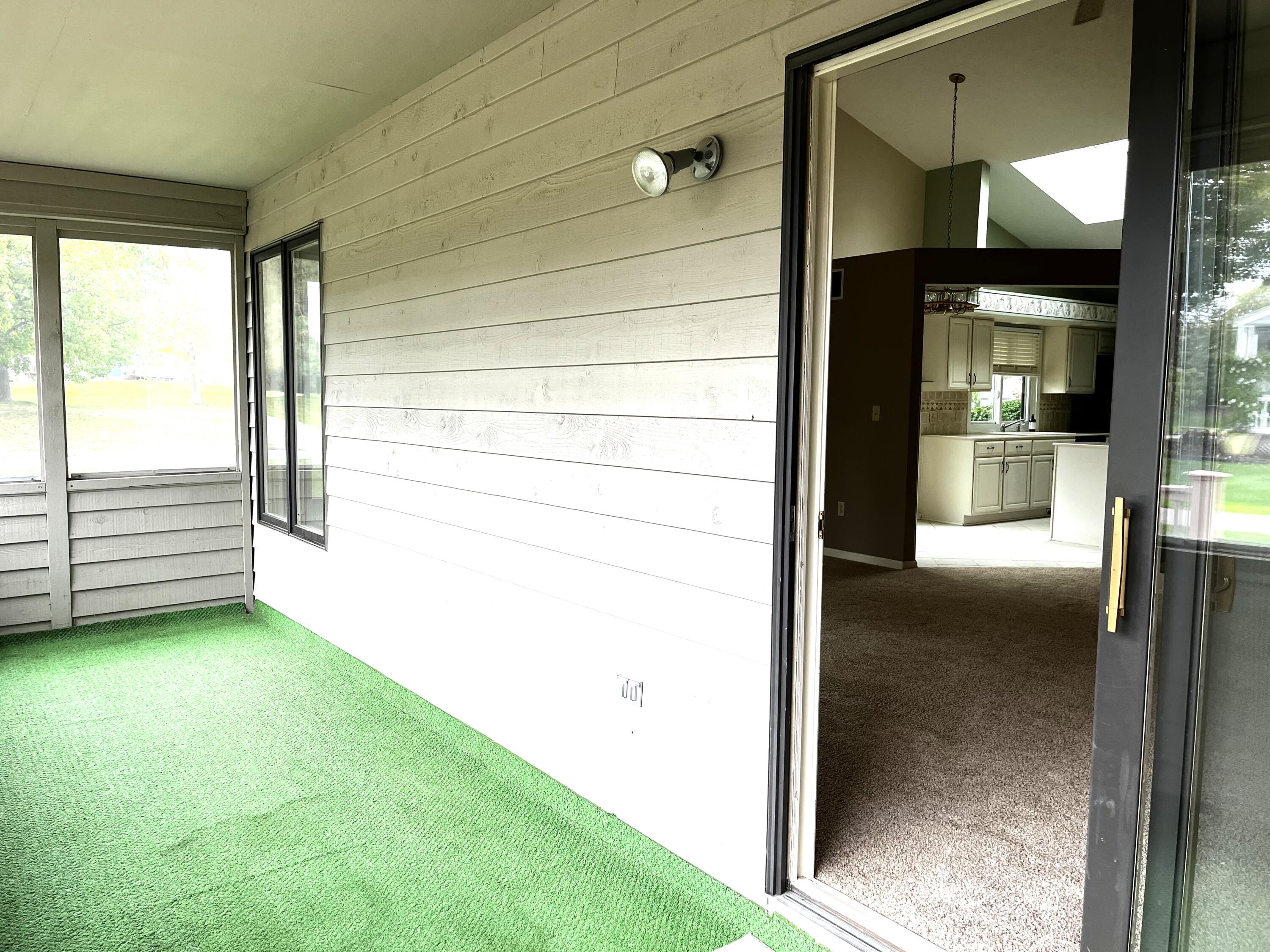 1821 Spring Meadow Court Southeast, Unit 29 Caledonia, MI 49316 - Photo 12 of 14 Screened Porch