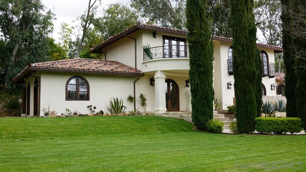 6511 Poco Lago Rancho Santa Fe, CA 92067 - Photo 2 of 24 a front view of a house with garden