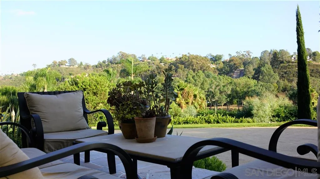 6511 Poco Lago Rancho Santa Fe, CA 92067 - Photo 21 of 24 a view of a chairs and table in patio