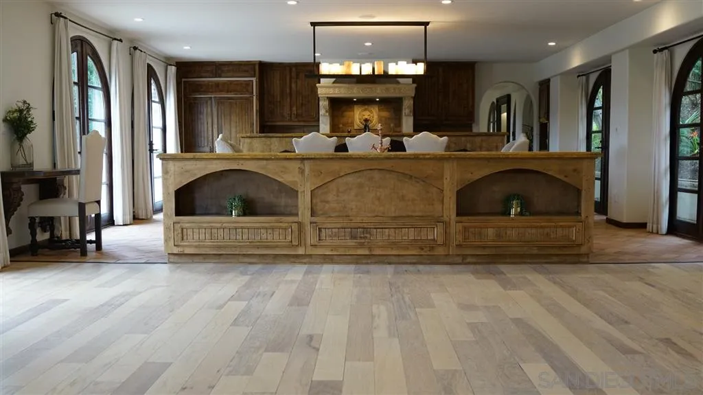 6511 Poco Lago Rancho Santa Fe, CA 92067 - Photo 3 of 24 a view of living room kitchen with furniture and a fireplace