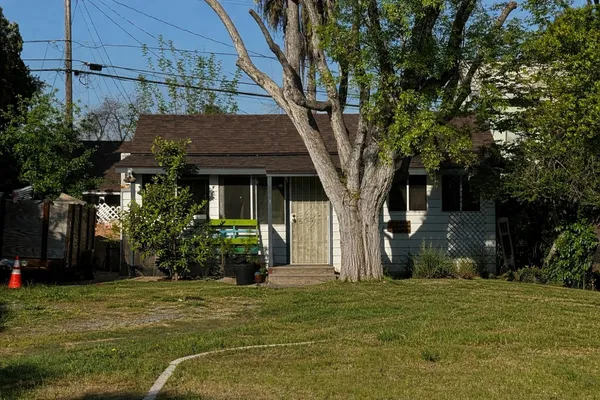 a front view of a house with garden