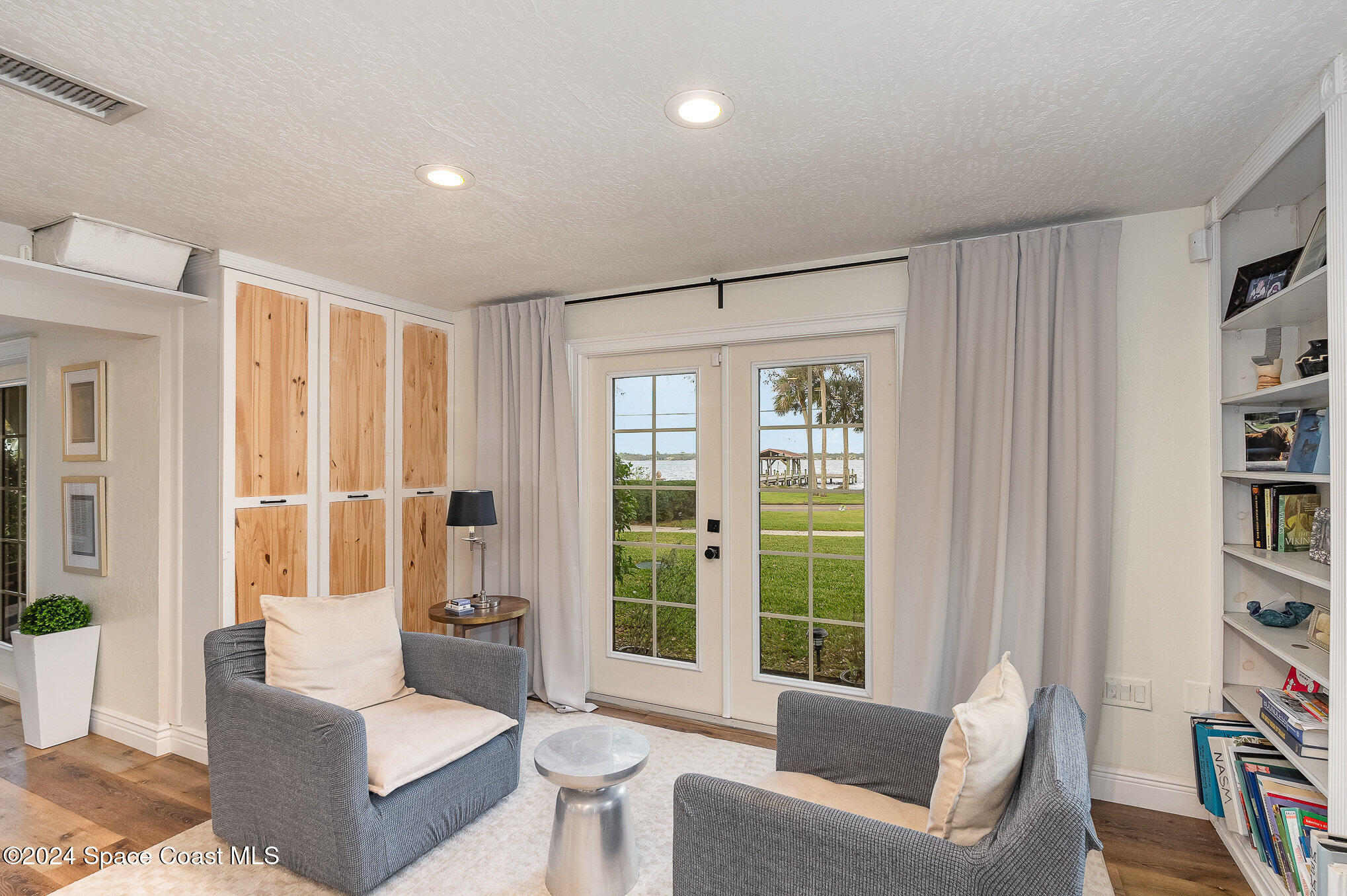 2175 Rockledge Drive Rockledge, FL 32955 - Photo 15 of 48 a living room with furniture and a large window