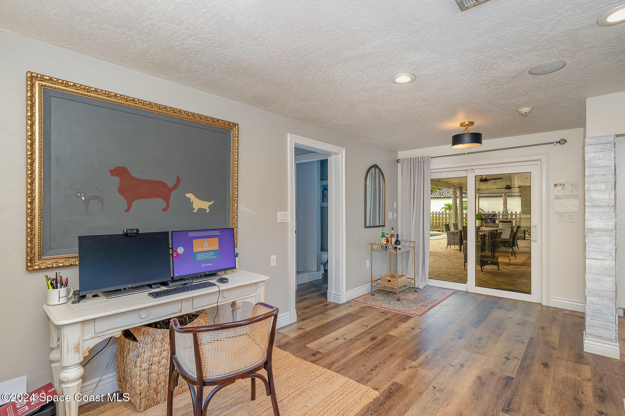 2175 Rockledge Drive Rockledge, FL 32955 - Photo 18 of 48 a living room with furniture a flat screen tv and a fireplace