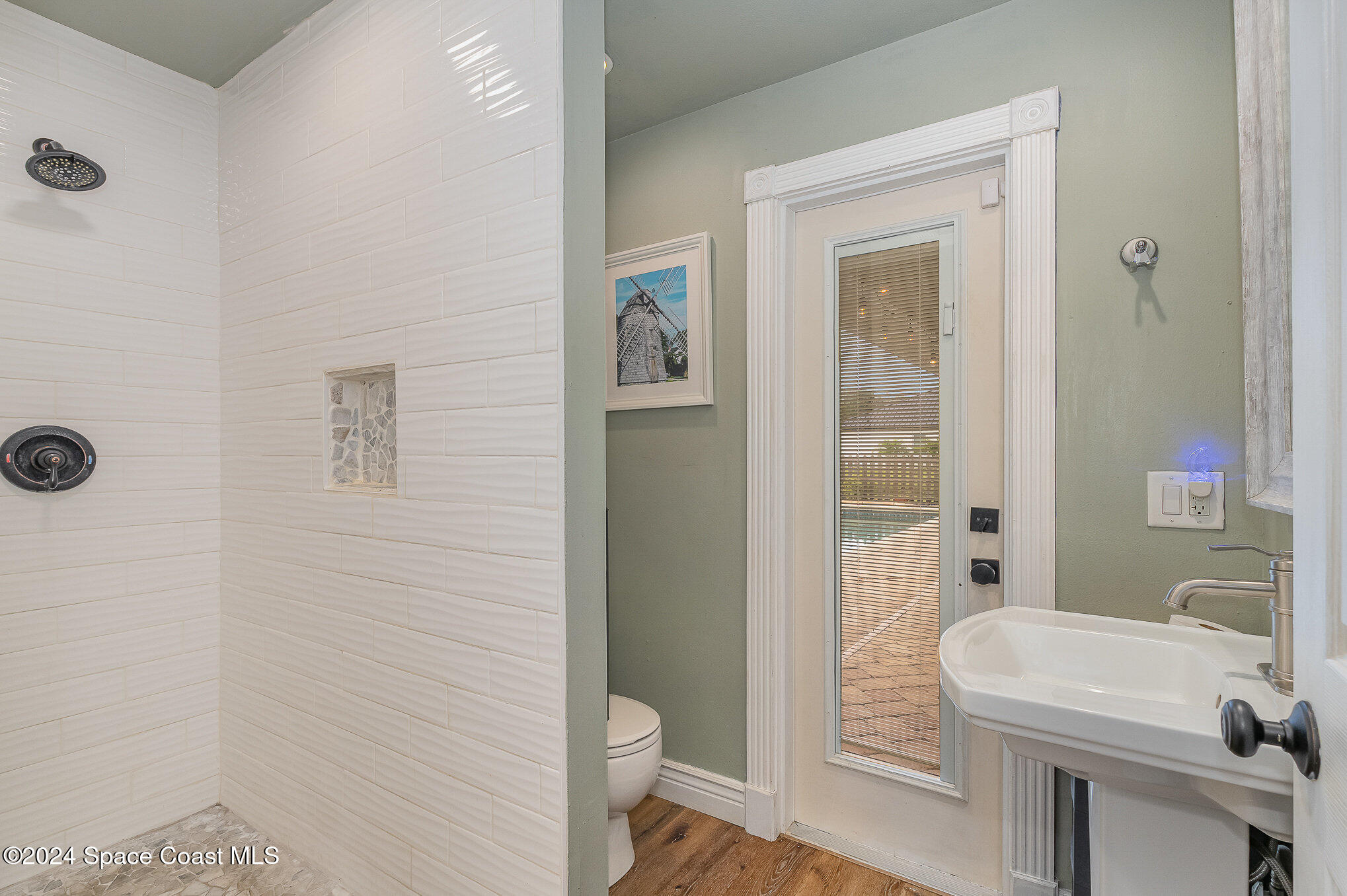 2175 Rockledge Drive Rockledge, FL 32955 - Photo 19 of 48 a bathroom with a sink a toilet and shower