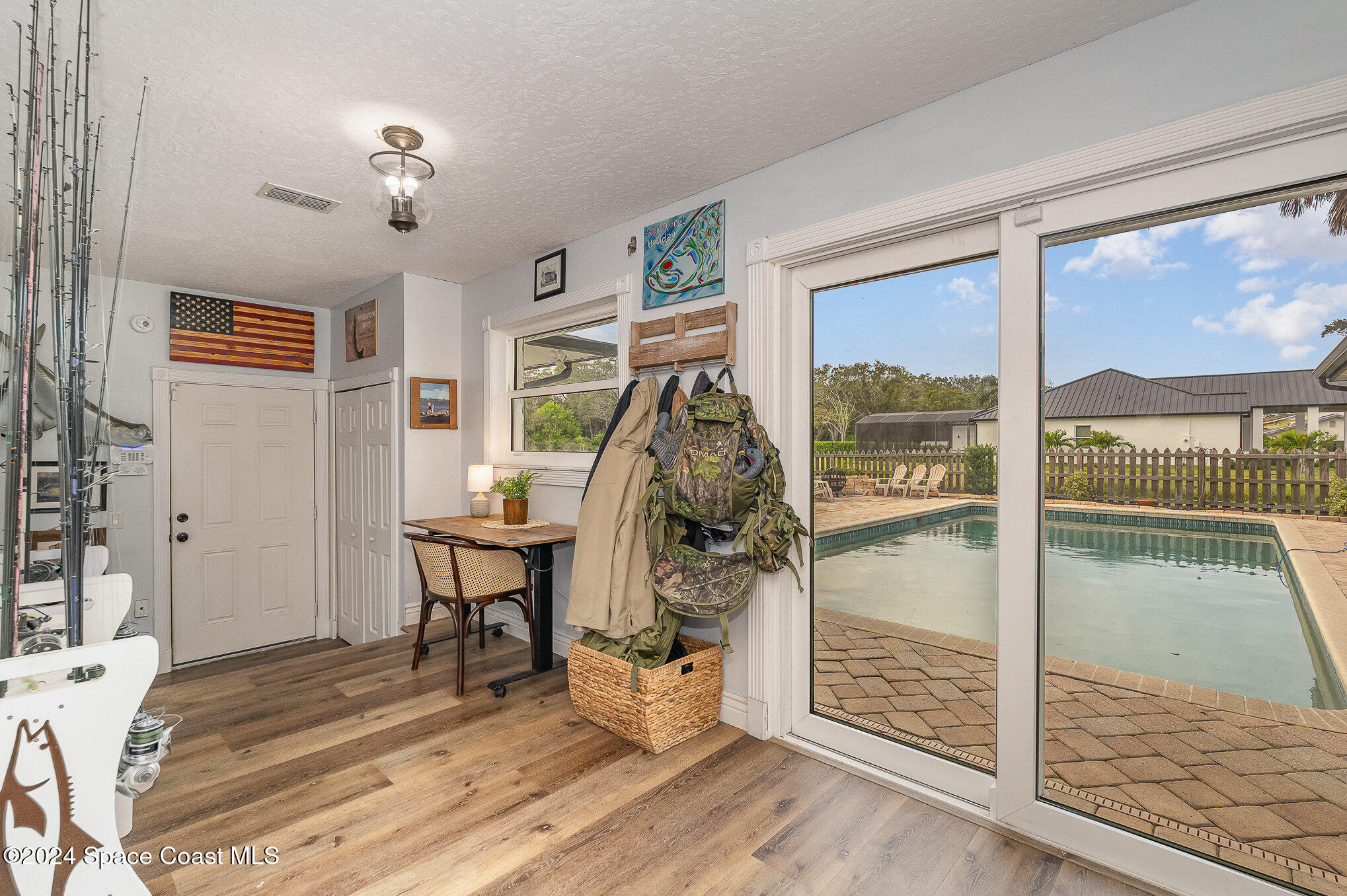 2175 Rockledge Drive Rockledge, FL 32955 - Photo 20 of 48 a view of a livingroom with wooden floor and a large window