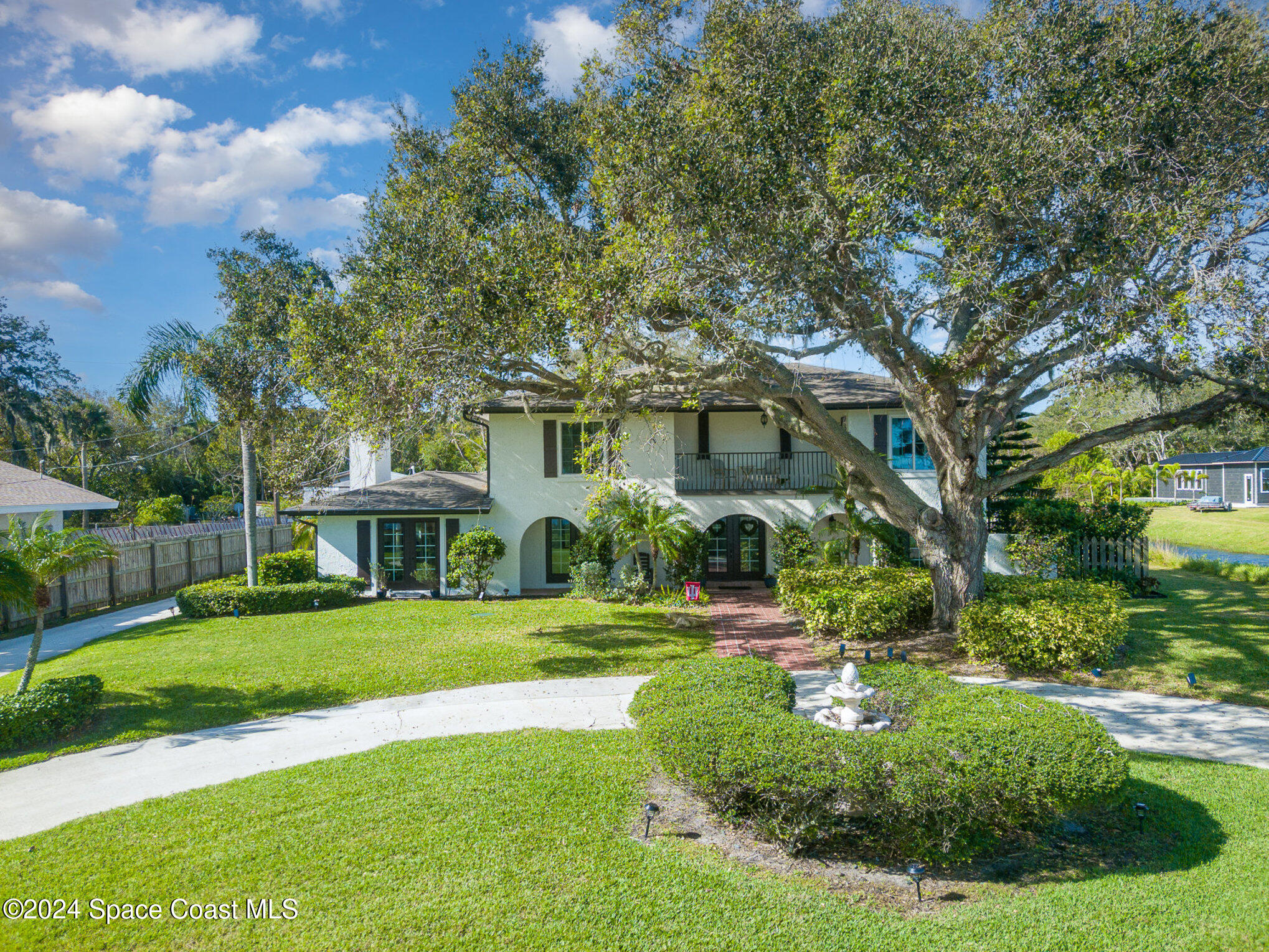 2175 Rockledge Drive Rockledge, FL 32955 - Photo 2 of 48 a front view of a house with a yard