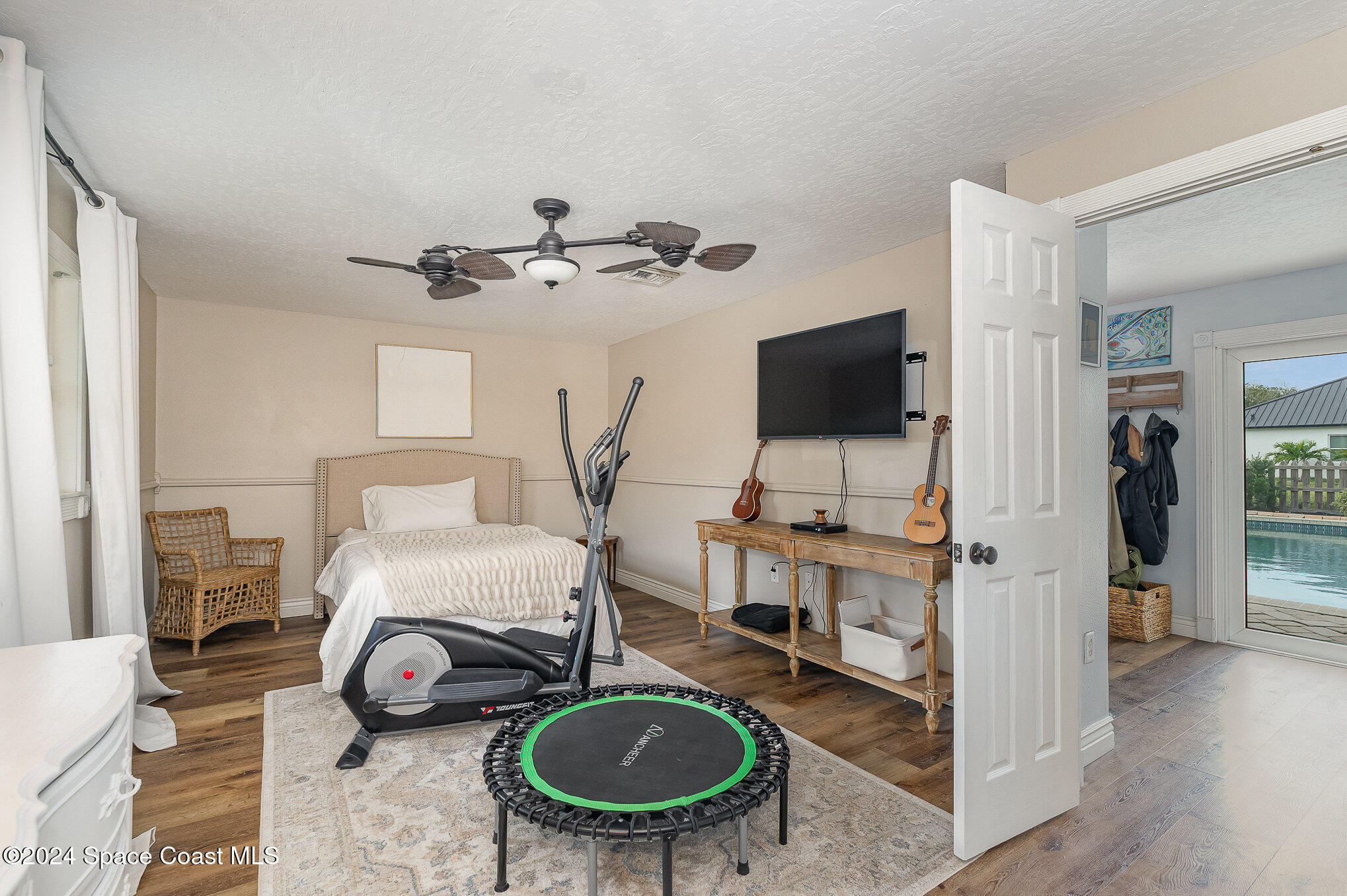 2175 Rockledge Drive Rockledge, FL 32955 - Photo 21 of 48 a bedroom with furniture and a flat screen tv