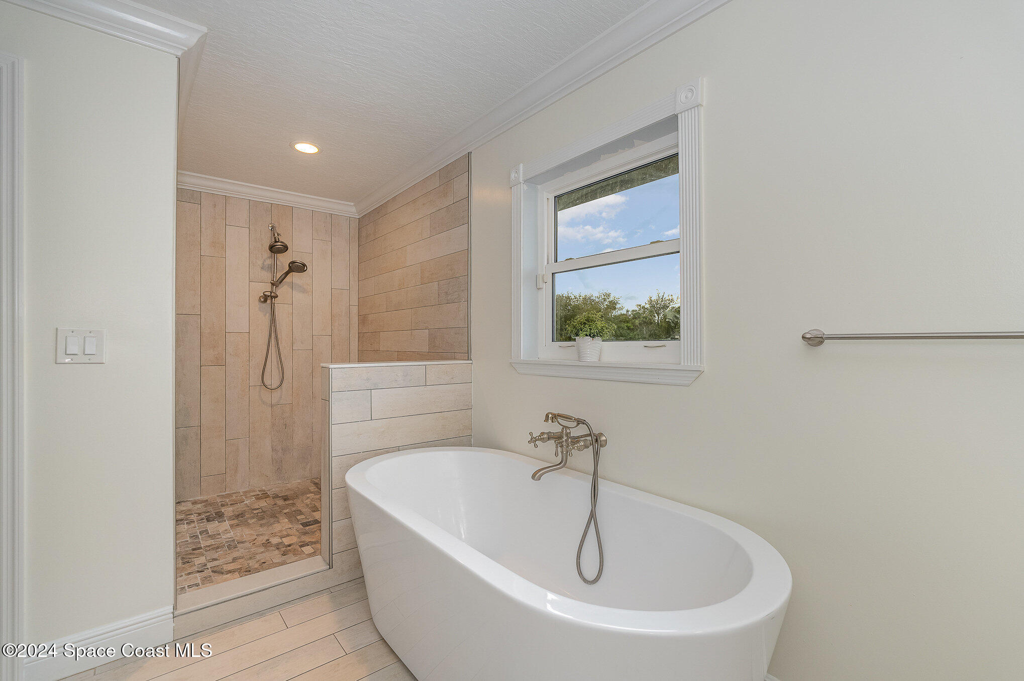 2175 Rockledge Drive Rockledge, FL 32955 - Photo 25 of 48 a white bath tub sitting next to a shower