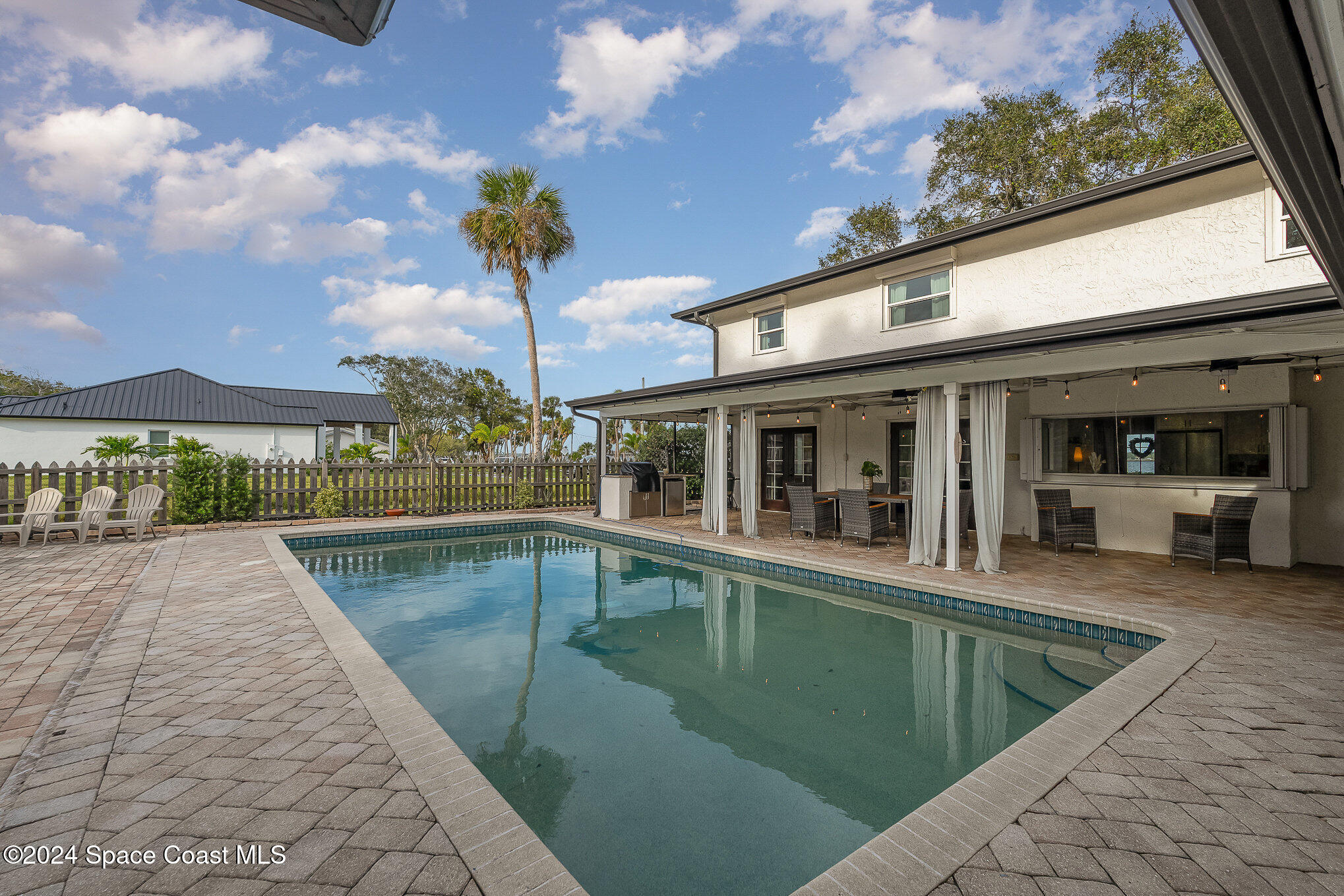 2175 Rockledge Drive Rockledge, FL 32955 - Photo 32 of 48 a view of a house with sitting area and swimming pool