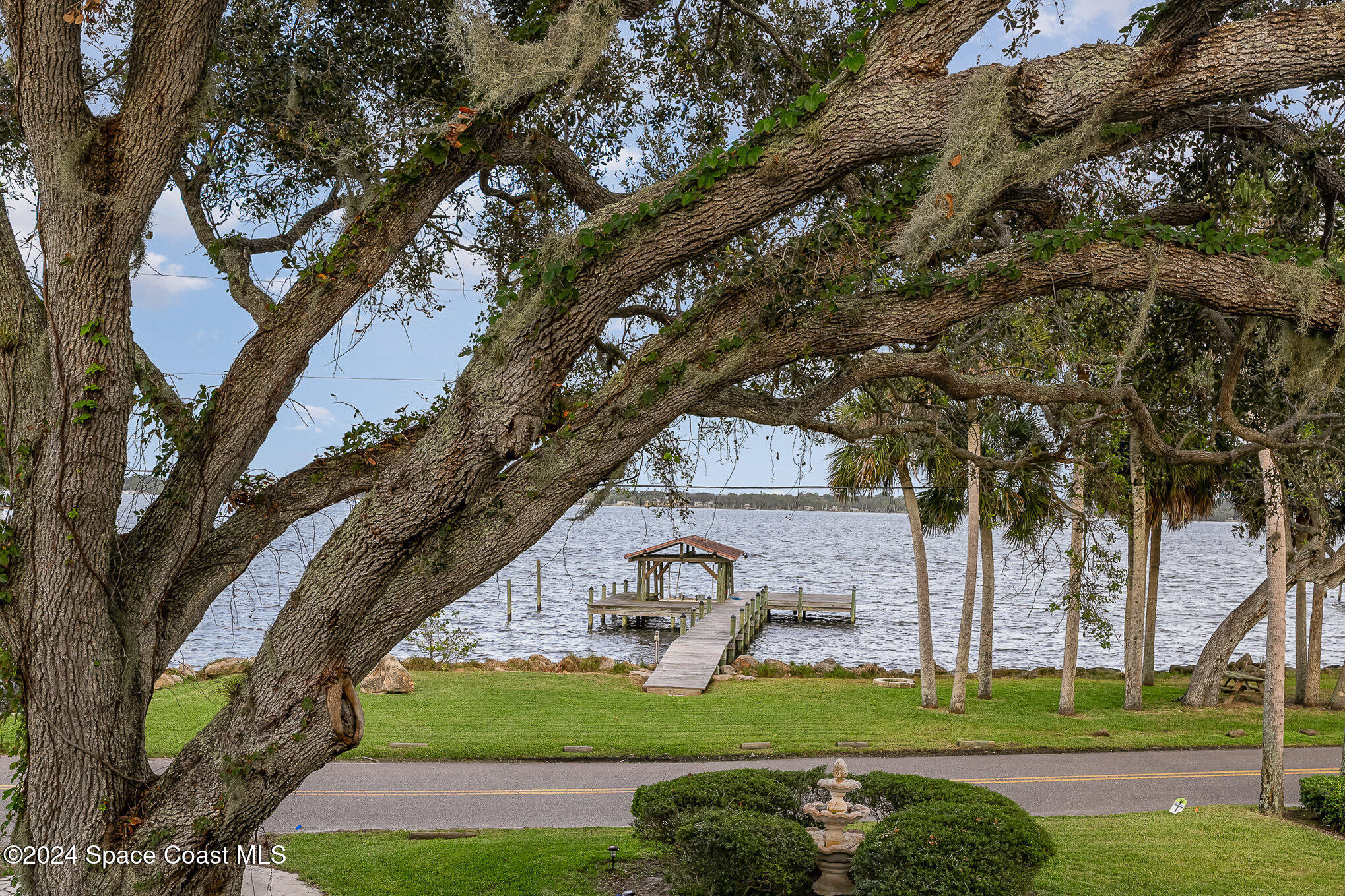 2175 Rockledge Drive Rockledge, FL 32955 - Photo 36 of 48 a front view of a house with garden