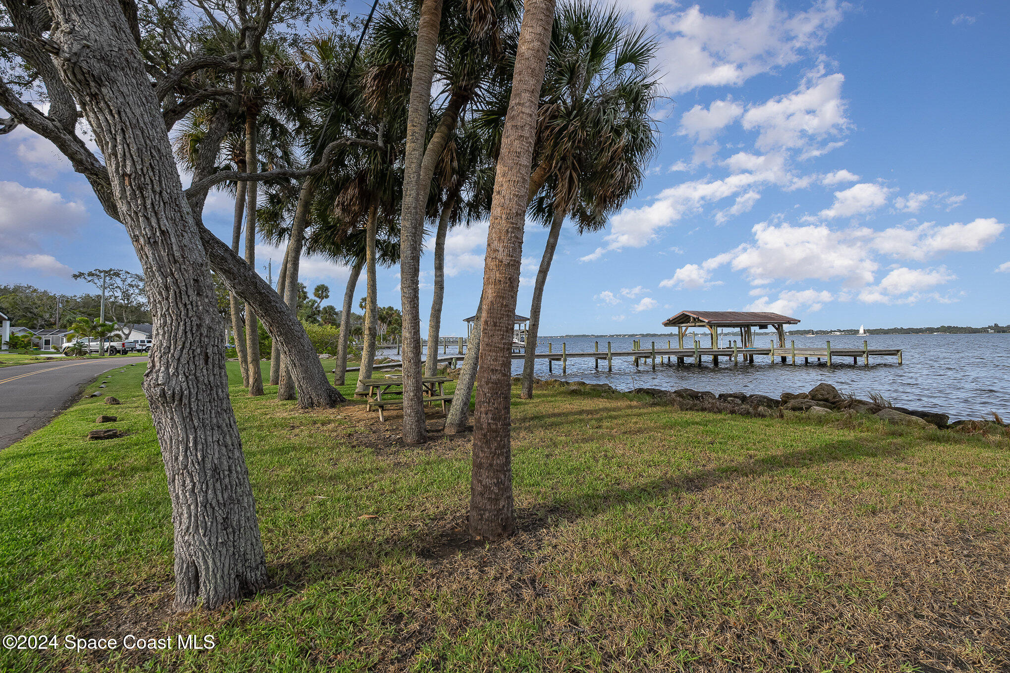2175 Rockledge Drive Rockledge, FL 32955 - Photo 37 of 48 a view of a yard with a large tree