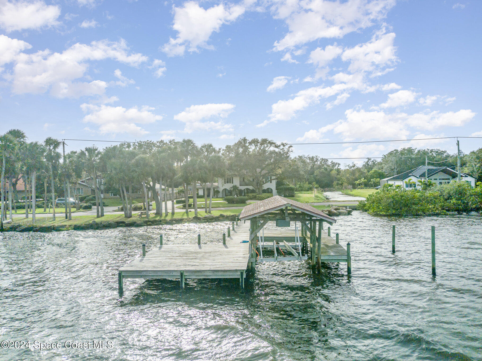 2175 Rockledge Drive Rockledge, FL 32955 - Photo 40 of 48 a view of a lake with a yard