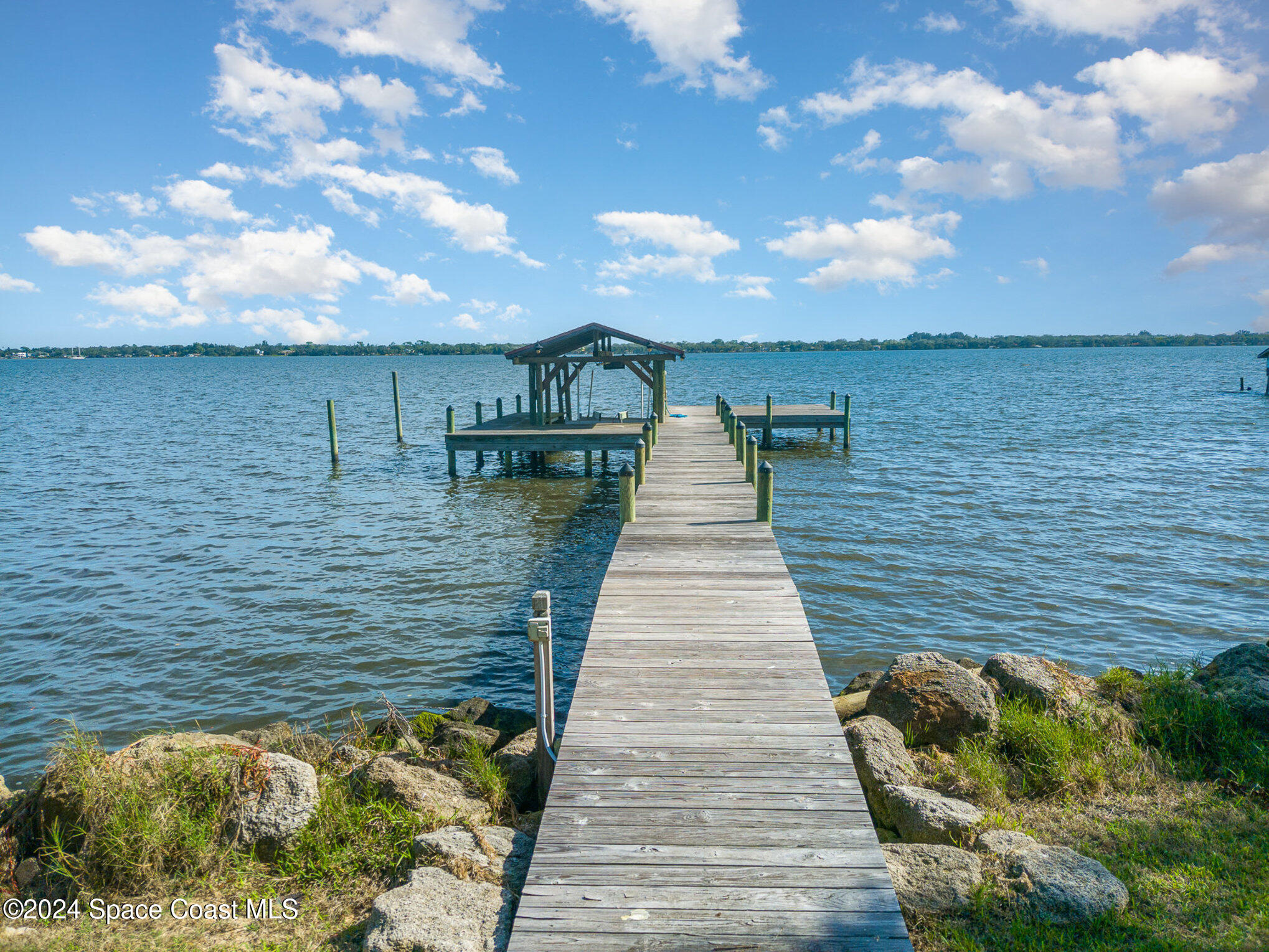 2175 Rockledge Drive Rockledge, FL 32955 - Photo 4 of 48 a view of a lake with large trees