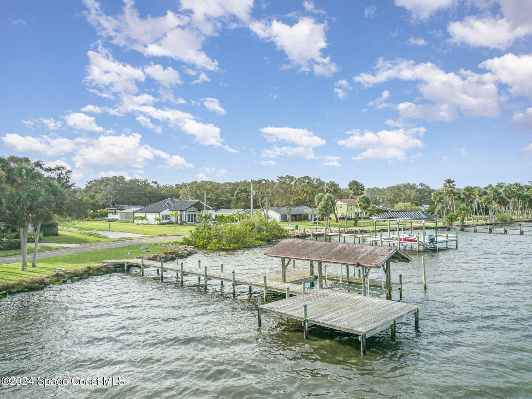 2175 Rockledge Drive Rockledge, FL 32955 - Photo 41 of 48 a view of a lake with a table and chairs