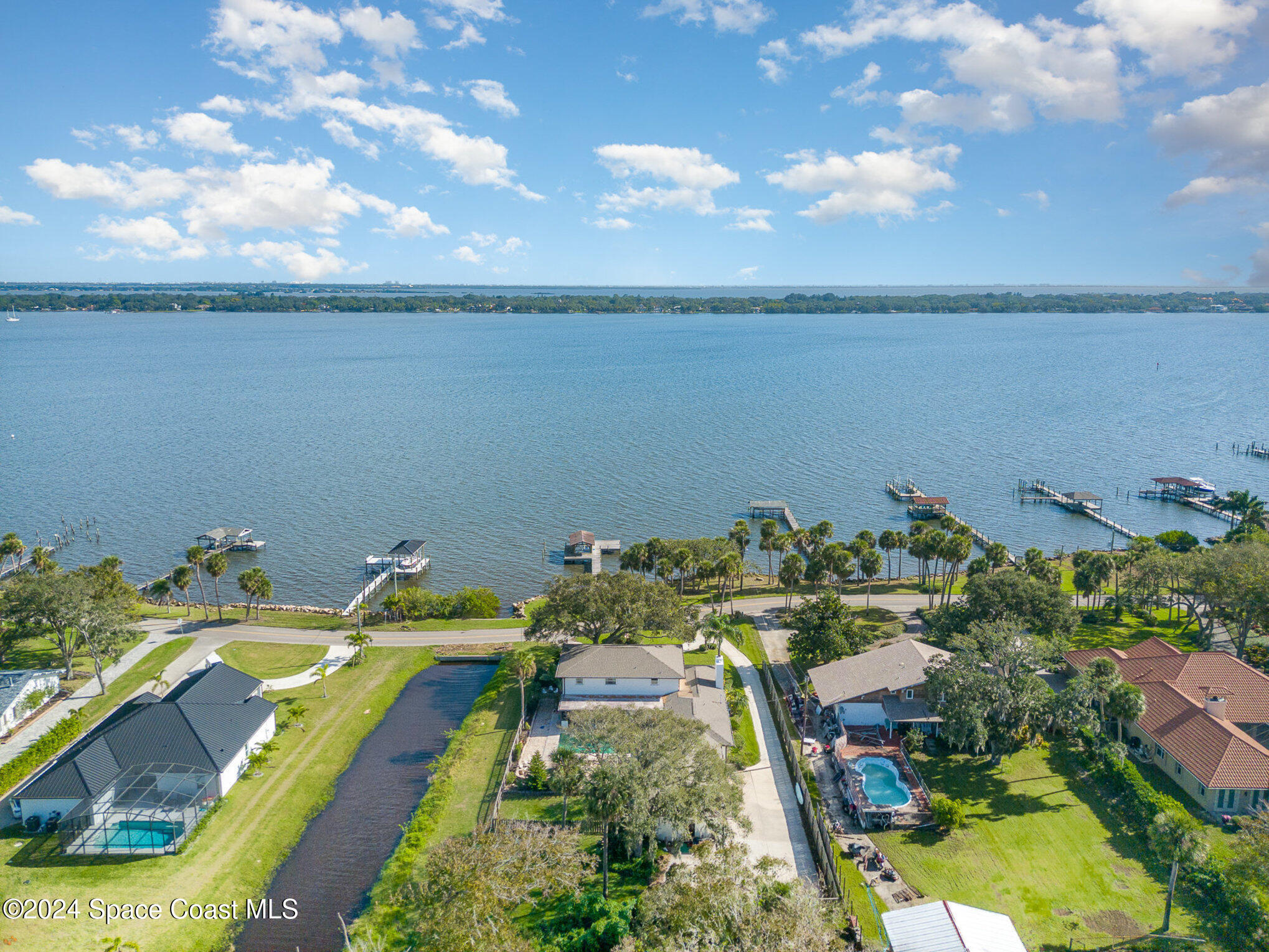 2175 Rockledge Drive Rockledge, FL 32955 - Photo 46 of 48 an aerial view of a house with a swimming pool outdoor seating and yard