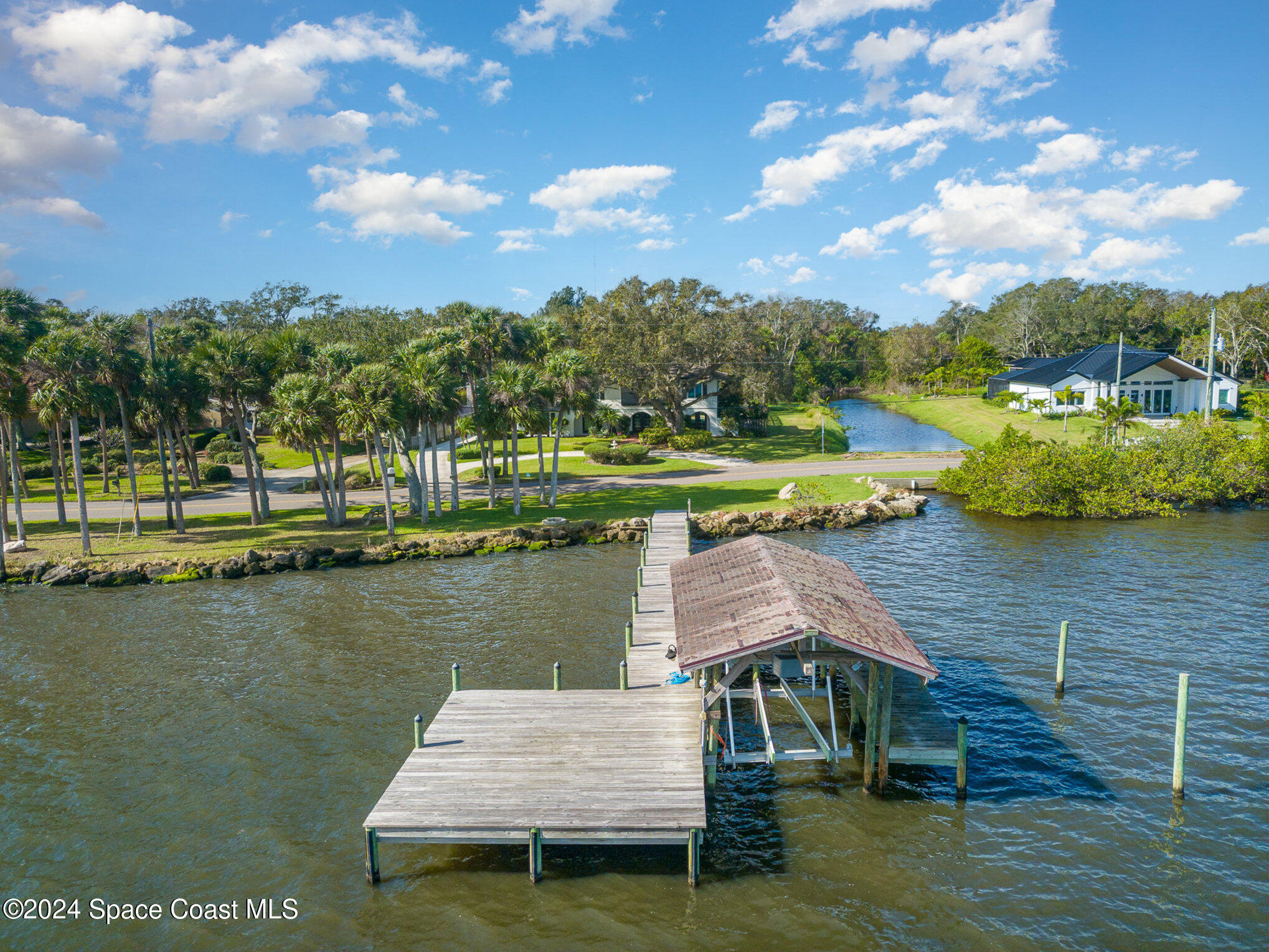 2175 Rockledge Drive Rockledge, FL 32955 - Photo 5 of 48 a view of a lake with a yard