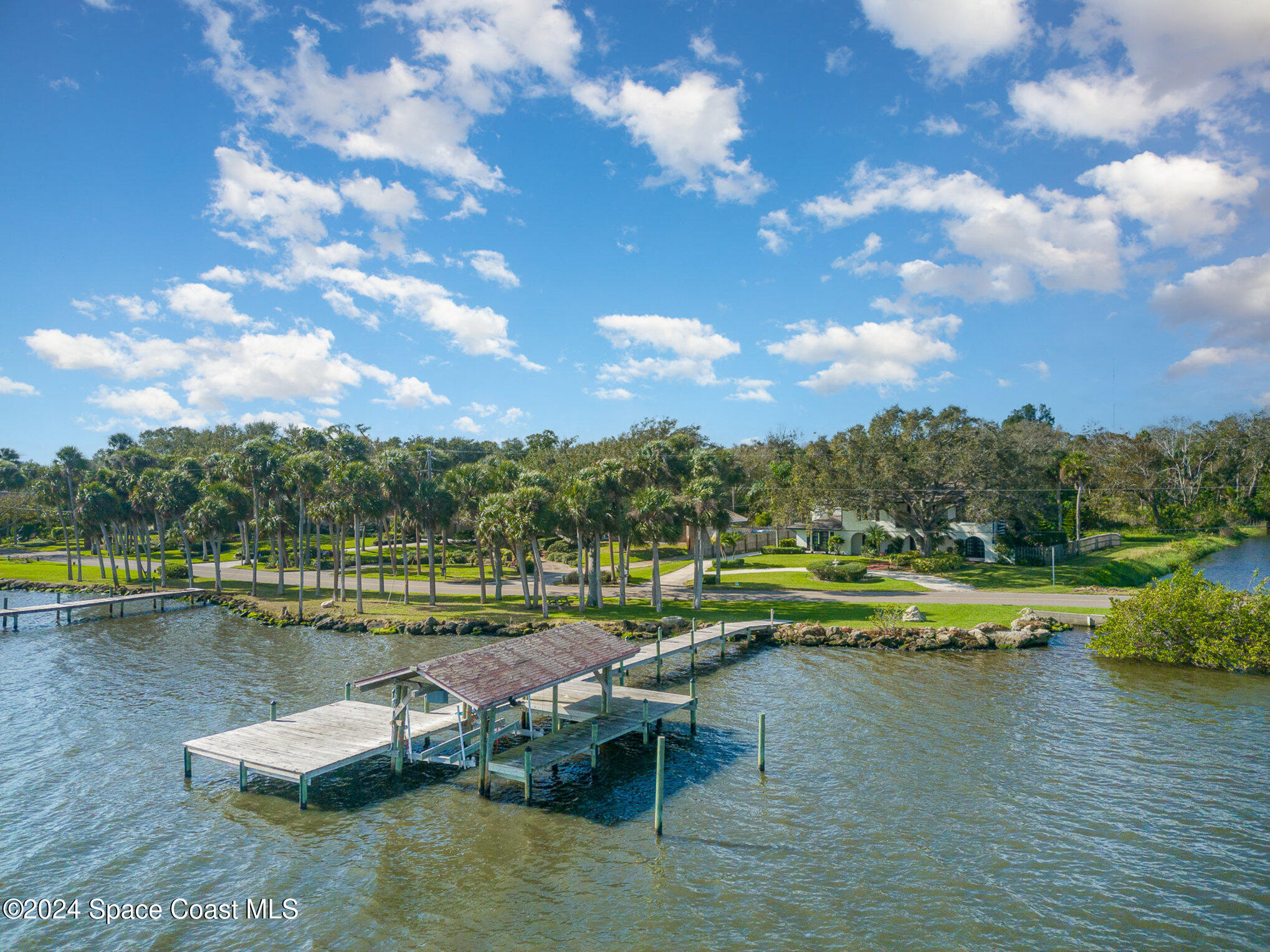 2175 Rockledge Drive Rockledge, FL 32955 - Photo 7 of 48 a view of a lake with a yard