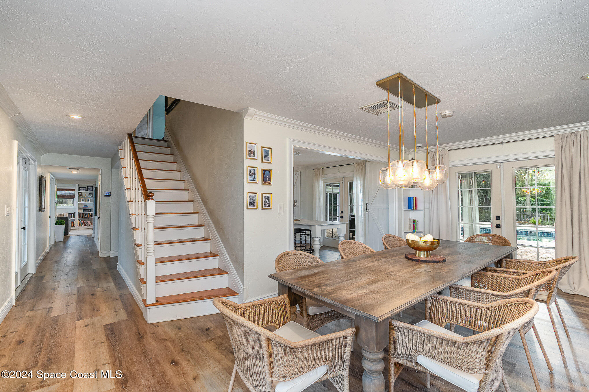 2175 Rockledge Drive Rockledge, FL 32955 - Photo 8 of 48 a view of a dining room with furniture and wooden floor