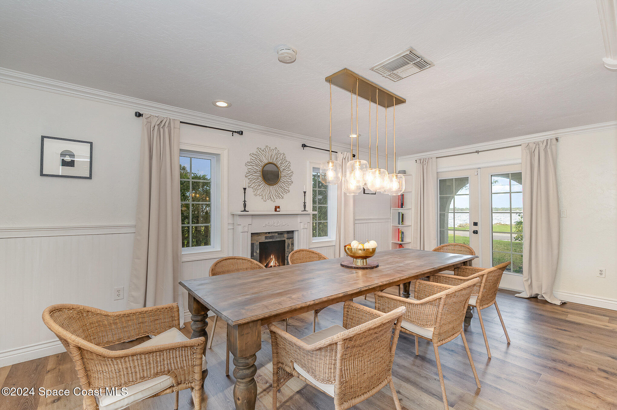 2175 Rockledge Drive Rockledge, FL 32955 - Photo 9 of 48 a view of a dining room with furniture and wooden floor