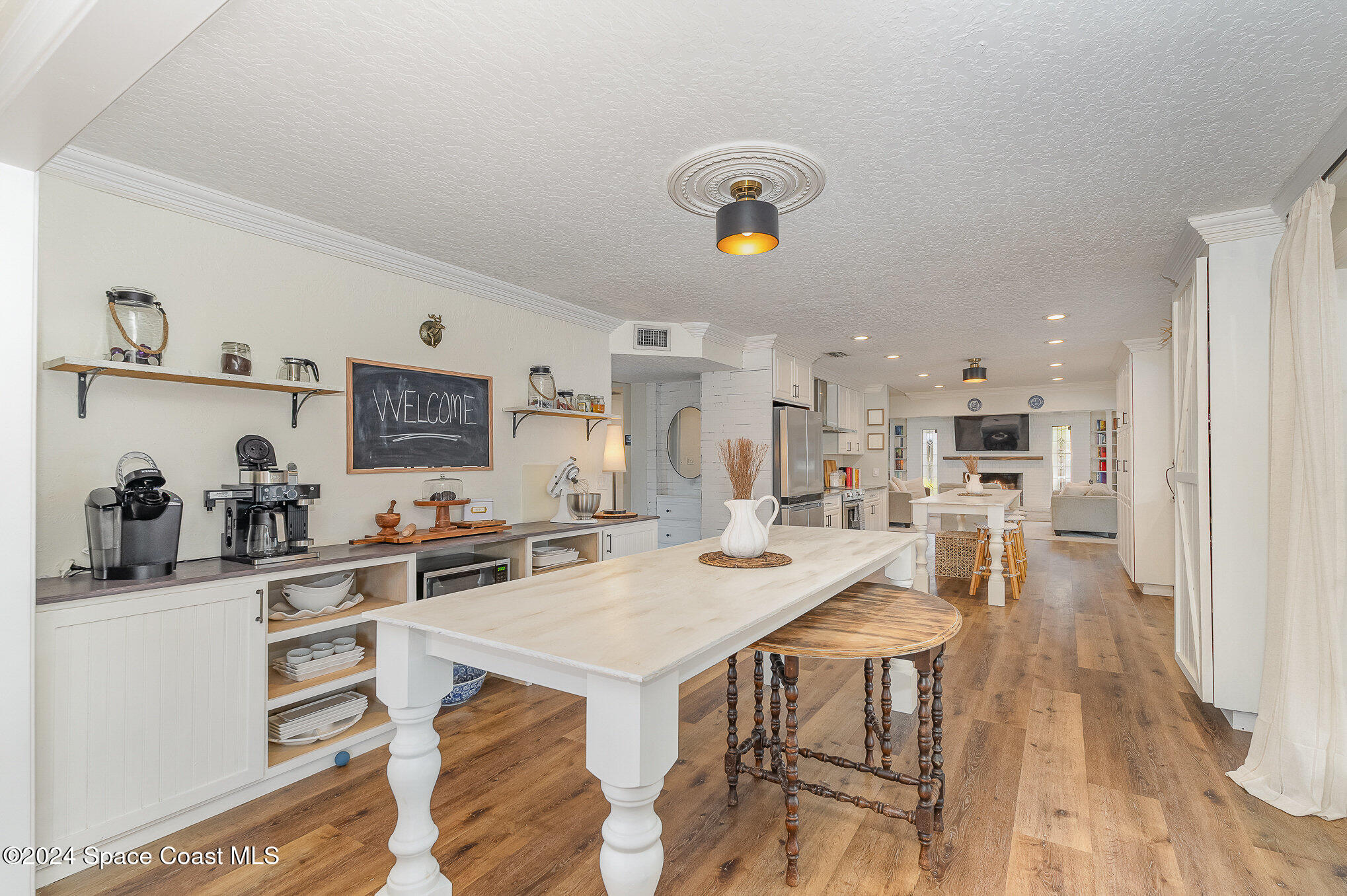2175 Rockledge Drive Rockledge, FL 32955 - Photo 10 of 48 a kitchen with a table chairs and a refrigerator
