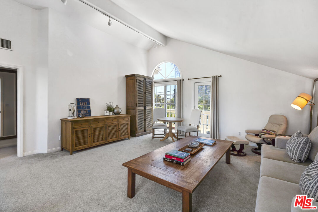 29355 Heathercliff Road, Unit GUESTHOUSE Malibu, CA 90265 - Photo 8 of 26 a living room with furniture and a large window