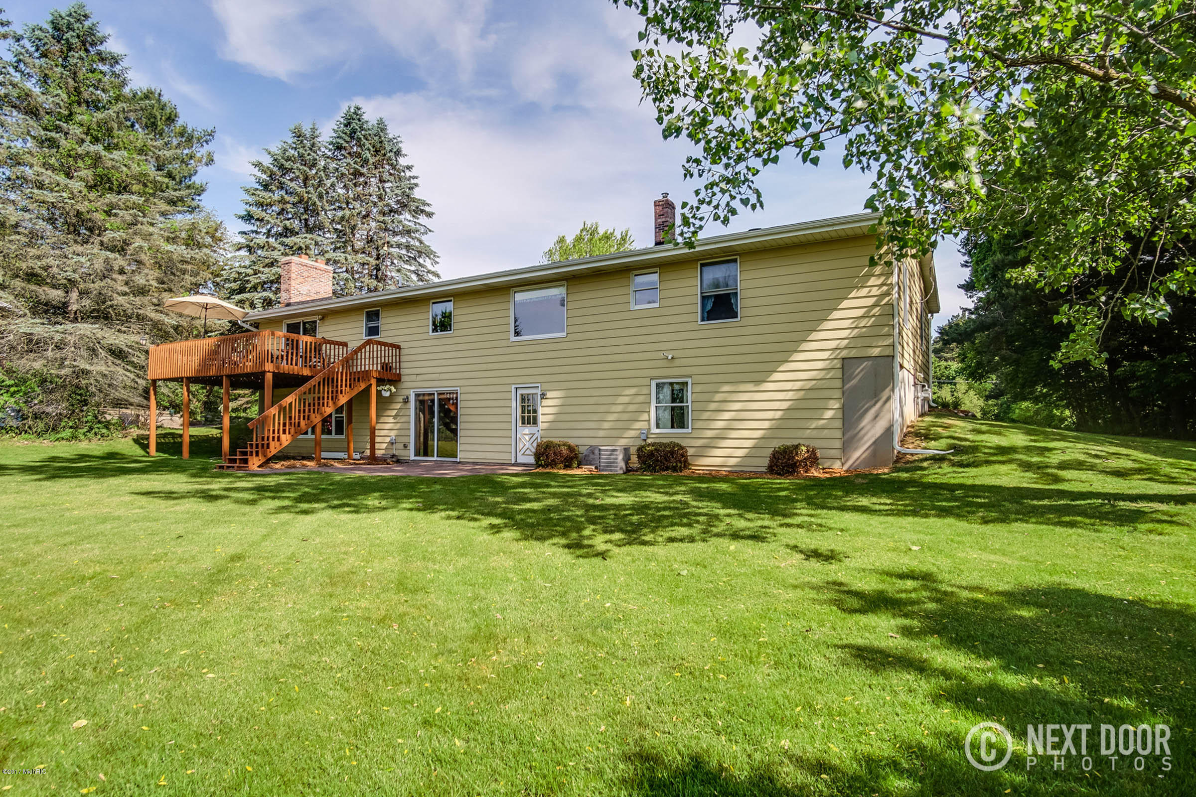 90 Indian Lakes Road Northeast Sparta, MI 49345 - Photo 62 of 72 Large Deck