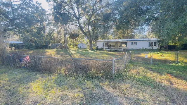 a view of swimming pool with a yard