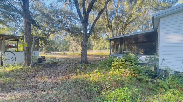 a backyard of a house with lots of green space