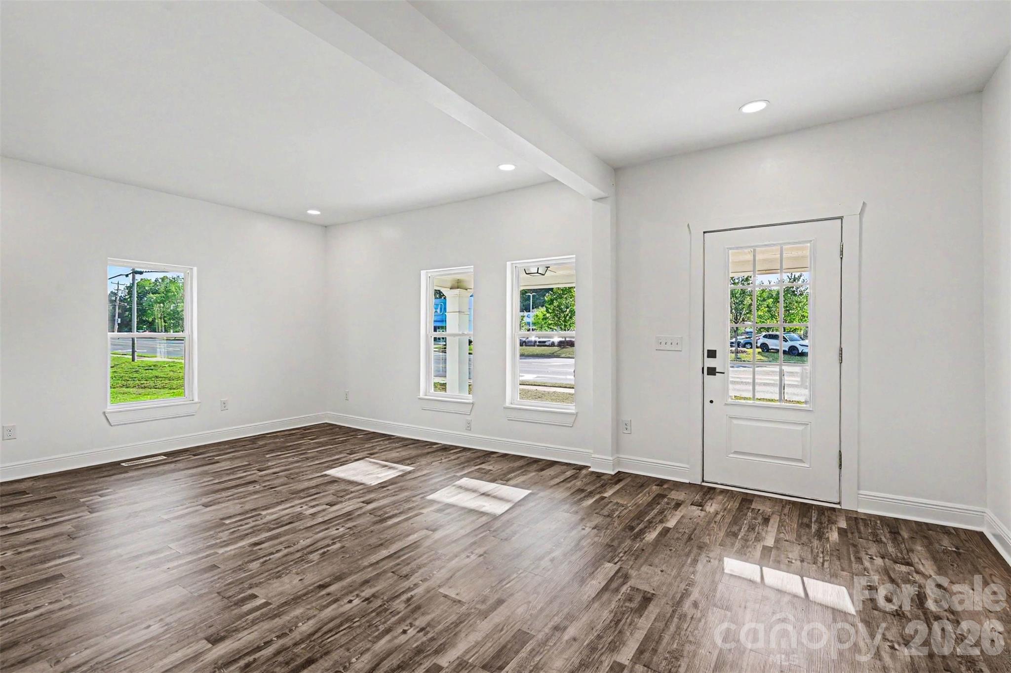 405 Aquadale Road Albemarle, NC 28001 - Photo 9 of 29 an empty room with windows