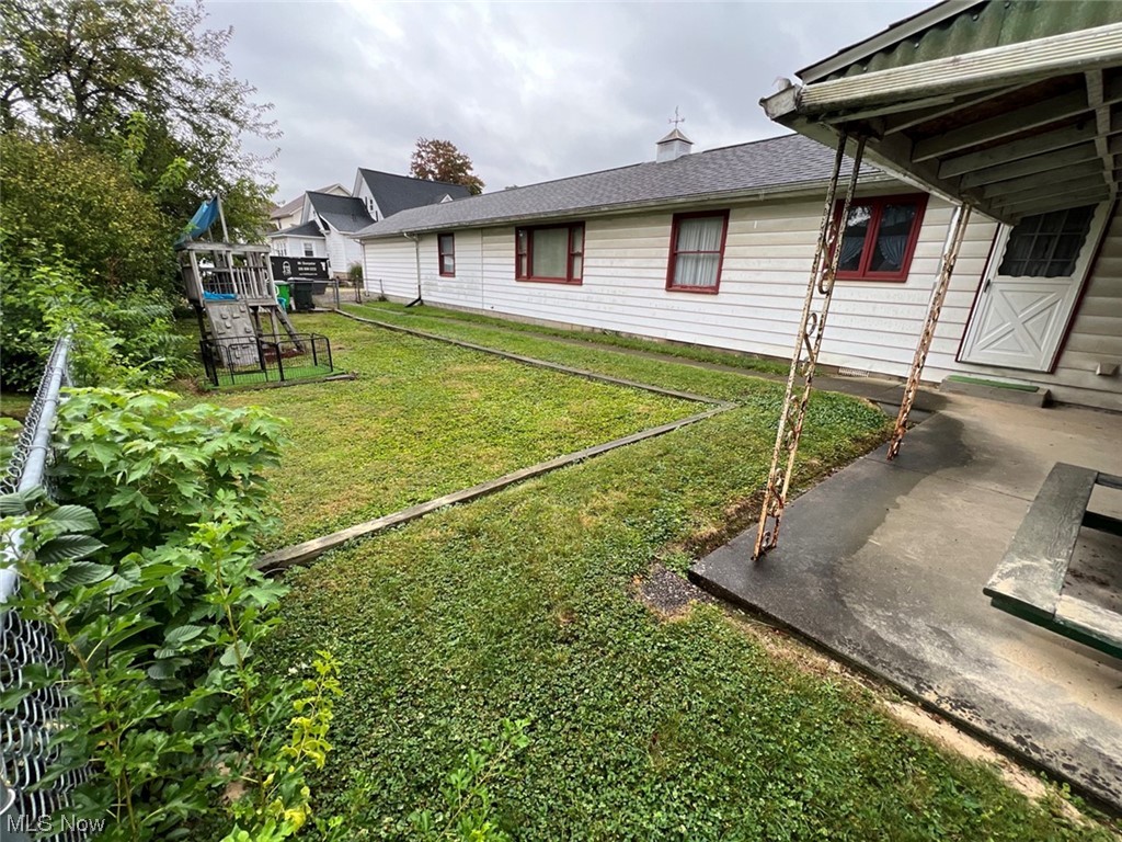 918 Amherst Road Northeast Massillon, OH 44646 - Photo 6 of 31 View of yard featuring a patio