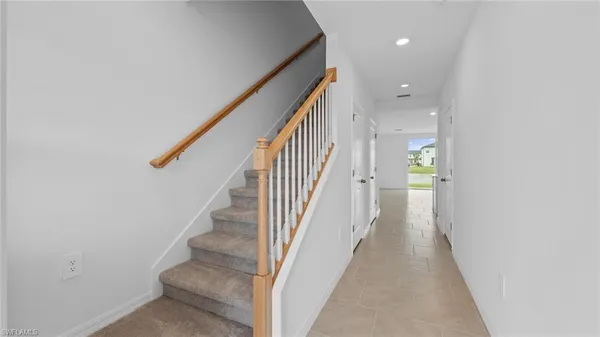 a view of a hallway with staircase