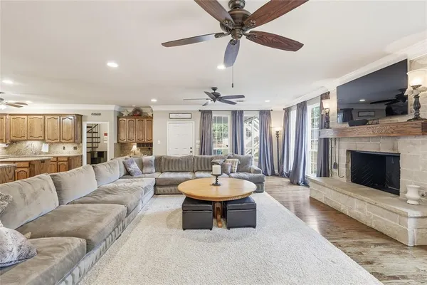 a kitchen with stainless steel appliances granite countertop a sink a stove and a refrigerator