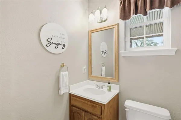 a large bathroom with a large tub sink and cabinets